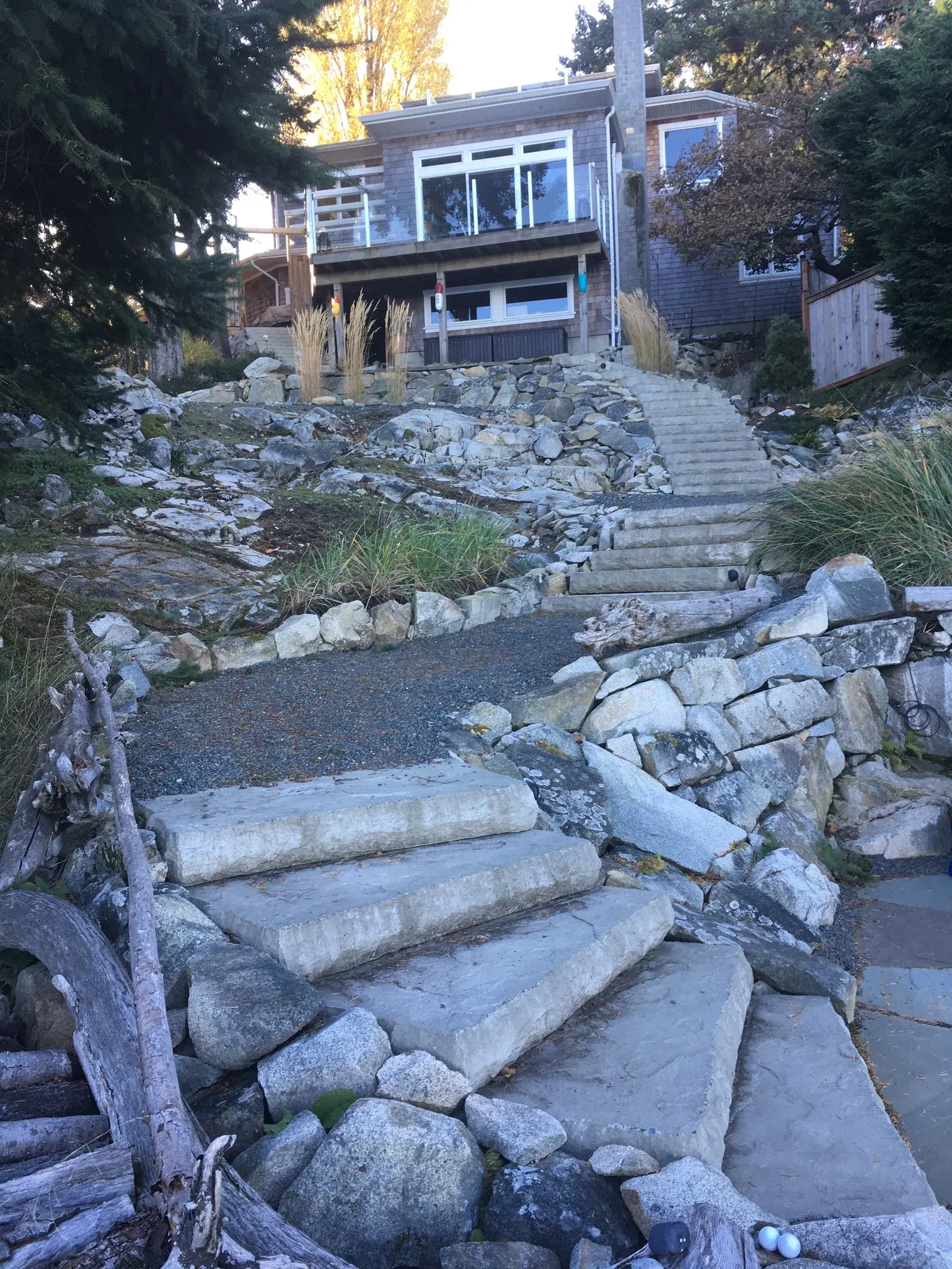 Broken concrete slabs stacked on a slope during demolition