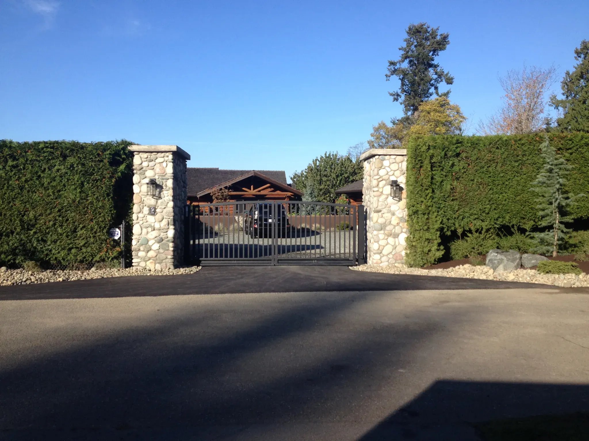Stone entry pillars flanking a driveway gate